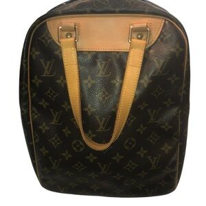 LOUIS VUITTON Excursion. Nice bag for carrying toiletries or a purse..